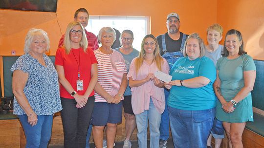 Farmers Cooperative Donates $875 To Auburn BackPack Program