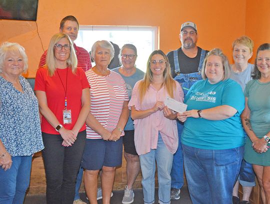 Farmers Cooperative Donates $875 To Auburn BackPack Program