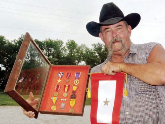 Gold Star Banners Presented to Families of Sgt. Larry R. Rieken and Specialist 4 Gary Schmidt, Killed in Action in Vietnam