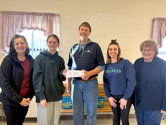 Proceeds From Hot Cocoa Stand Given to Auburn Backpack Program