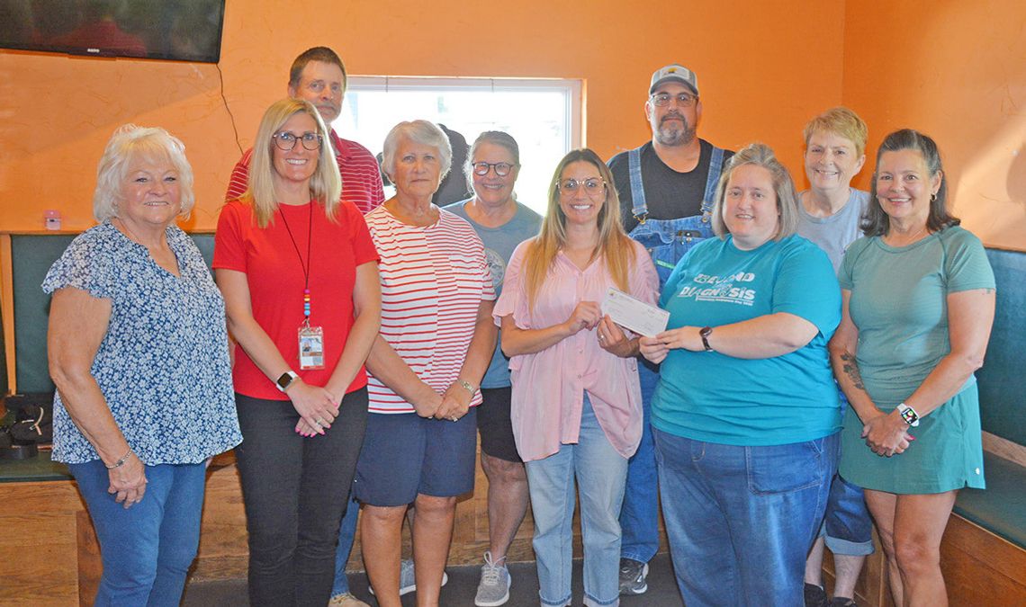 Farmers Cooperative Donates $875 To Auburn BackPack Program