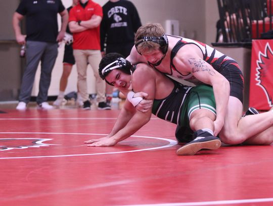 Logan Rowell works for a pin in his first round match