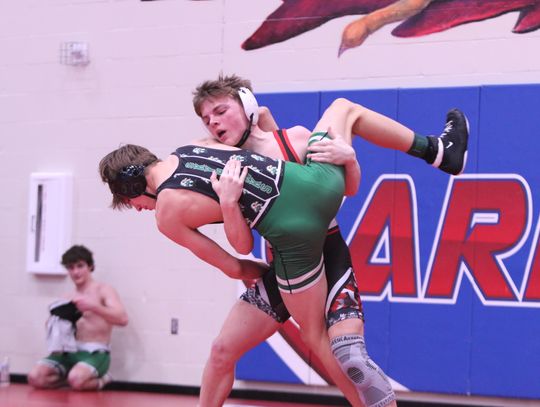 Ryan Hayes lifts and takes his opponent down