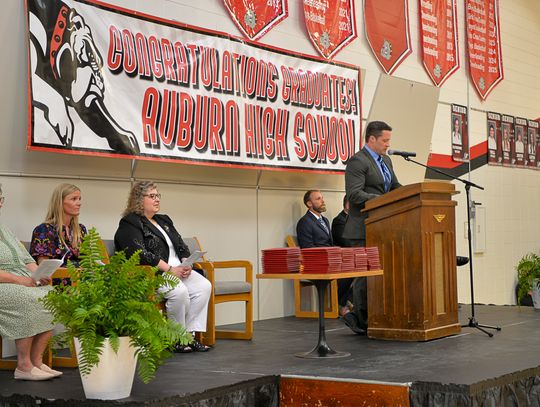 Principal Scott Siegal at podium
